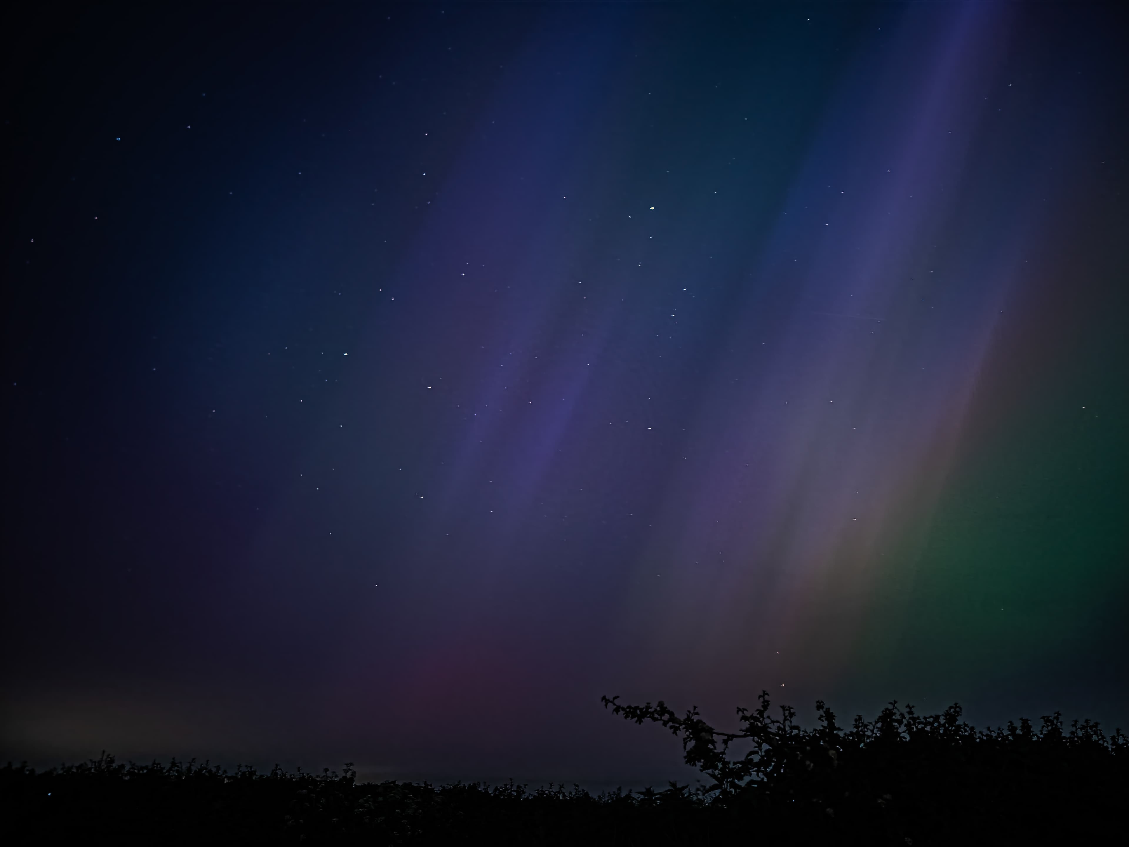 This is an image I took of Aurora Borealis in the UK. I was lucky to capture an image that you can see both the lights and some stars.